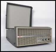 A vintage portable four speed record player by Murphy, dials and speaker to front, BSR deck to the