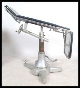 A vintage 20th century Industrial / medical dentists chair / surgeons theatre bed of enamel