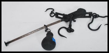 A pair of 19th century ebonised hand held cast metal / iron sack scales, no visible makers name