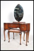A mid century Queen Anne Revival mahogany kidney shaped dressing table, central drawer flanked by