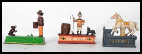 A collection of vintage style cast iron money boxes ( moneybox ) to include Trick Pony, Trick Monkey