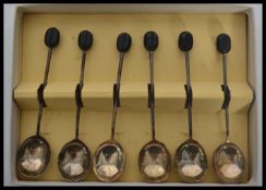 A set of six cased silver hallmarked coffee bean coffee spoons, Sheffield assay marks, possibly by