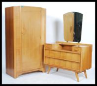 A retro 20th century double wardrobe and dressing table bedroom suite by Avalon.