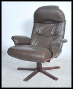 A stunning leather and bentwood swivel armchair in the Danish manner. The quadruped base