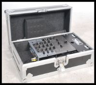 A Numark DM2050 Professional 3 Channel DJ mixer with leads together with a good aluminium cased