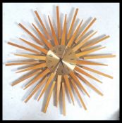 A vintage retro 20th century Paico teak sunburst / atomic wall clock