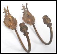 A pair of 19th century gilt brass wall lights sconces in the style of Adam. The arms of scrolled