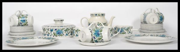 A 20thj century retro part dinner and tea service by Midwinter consisting of teapot, cups, plates,