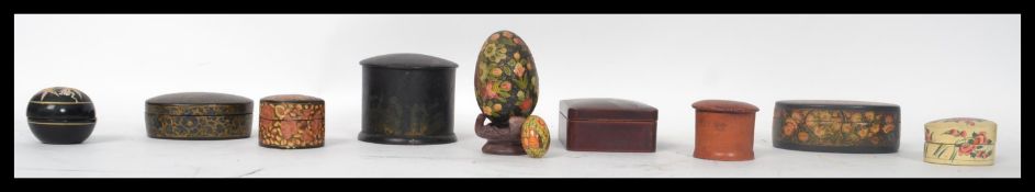 A collection of 20th century papier mache boxes to include examples from the early 20th century