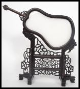 An unusual 20th century Chinese carved mutton jade panel depicting two dragons chasing the flaming