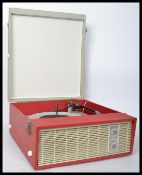 A vintage retro 20th century two tone vinyl cased record player with dials to front. When closed