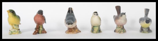 A collection of ceramic bird figurines by Beswick to include Grey Wagtail, Greenfinch, Goldcrest