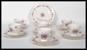 A vintage mid 20th century bone China tea service by Queen Anne, consisting of cups, saucers,