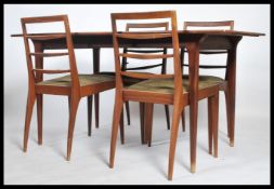 A 1960's mid century teak wood McIntosh of Kirkcaldy dining room suite. The teak extending dining