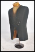A vintage 20th century shop dummy - mannequin. The haberdashery torso finshed with black fabric on