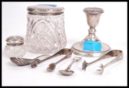 A hallmarked silver stub candle stick of larger form having a gadrooned circular base along with
