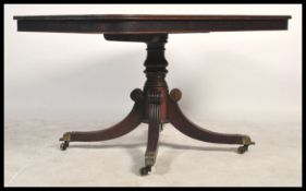 A 19th century Regency breakfast table, circa 1835, the rectangular crossbanded top with rounded