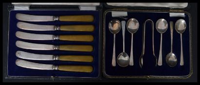A silver hallmarked cased set of six silver teaspoons and unassociated  plated sugar tongs, London