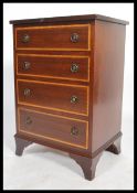 A Georgian style regency revival bachelors mahogany chest of drawers of smaller proportions having