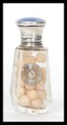 A hallmarked silver and cut glass smelling salts pot having an enamel lid. Complete with original