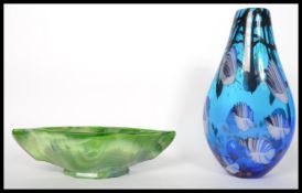 An early 20th century Art Deco green glass bowl along with a mid 20th century studio art glass vase.