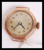 A hallmarked 9ct gold cocktail watch. The champagne dial having faceted hands with gilt Art Deco