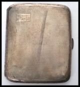 An early 20th century 1920's silver hallmarked cigarette case having an engine turned design.