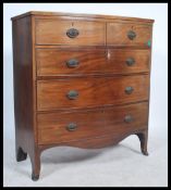 A Victorian 19th century mahogany bow front chest of drawers being raised on kick legs with 2