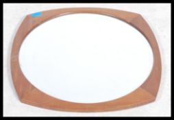A retro 20th century teak wood atomic G - Plan frame less wall mirror. Measures 57cm.