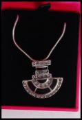 A silver and marcasite art deco style pendant necklace set with onyx complete in presentation