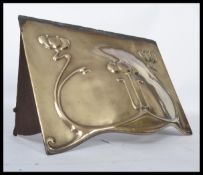 A 19th century Victorian Art Nouveau brass fire hood marked to reverse The Lothan. Measures 23 cm