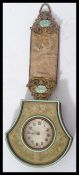 A 19th century Austrian tapestry and brass hanging carriage / sedan chair clock of axe head form.