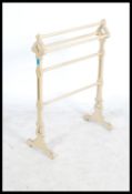 A Victorian 19th century painted ecclesiastical towel rail of unusual shape with canted uprights