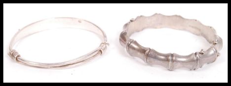 A mid century brutalist silver hallmarked ladies bangle by E Lilley & Co bearing Birmingham