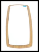 A vintage 20th century retro teak wood frameless atomic / sputnik style wall mirror of lozenge