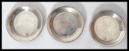 A group of three Egyptian silver hallmarked peanut dishes, Cairo assay marks and dating to 1940 /