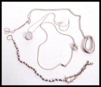 A dealers lot of silver to include long silver necklace of ball form with abstract lozenge