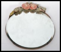 A 19th century Victorian Barbola mirror of circular form. The bevelled glass mirror having a