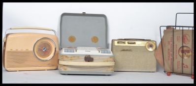 A vintage reel to reel player together with vintage radios, record rack etc.