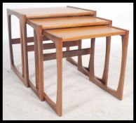 A G-Plan retro teak wood 1970's graduating nest of tables in the Quadrille pattern. The tables
