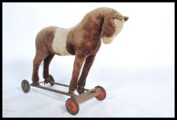A vintage ride on mid century childrens horse. The