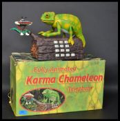A 20th century retro novelty advertising Karma Chameleon telephone. Moving Chameleon figure,