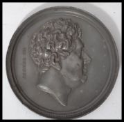After Sir Francis Leggatt Chantrey (1781-1841). A George IV metallic proof portrait medallette