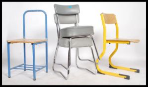 A pair of vintage mid 20th century metal tubular framed stacking chairs together with two none