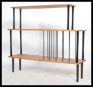 A retro 20th century music entertainment floor standing shelving unit. The shelving unit having