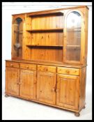 A good quality 20th century Pine welsh dresser by Ducal. The  base with a series of short drawers