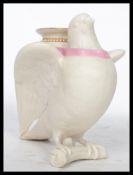 A 19th century Royal Worcester ivory porcelain dove vase being modelled as a dove with its out