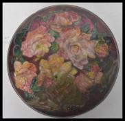 CAMILLE FAURE (1874-1956) A lidded pot enamelled with a band of flowers in colours, signed C.