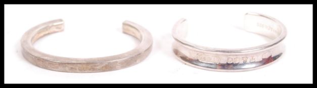 A silver 925 ladies bangle stamped for T&Co 1837 together with another silver brutalist style