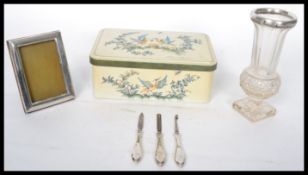A group of silver hallmarked items to include three silver handled files / picks , a silver collared